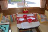 Great example of the dining table and seating bolsters in a restored vintage Aladdin travel trailer